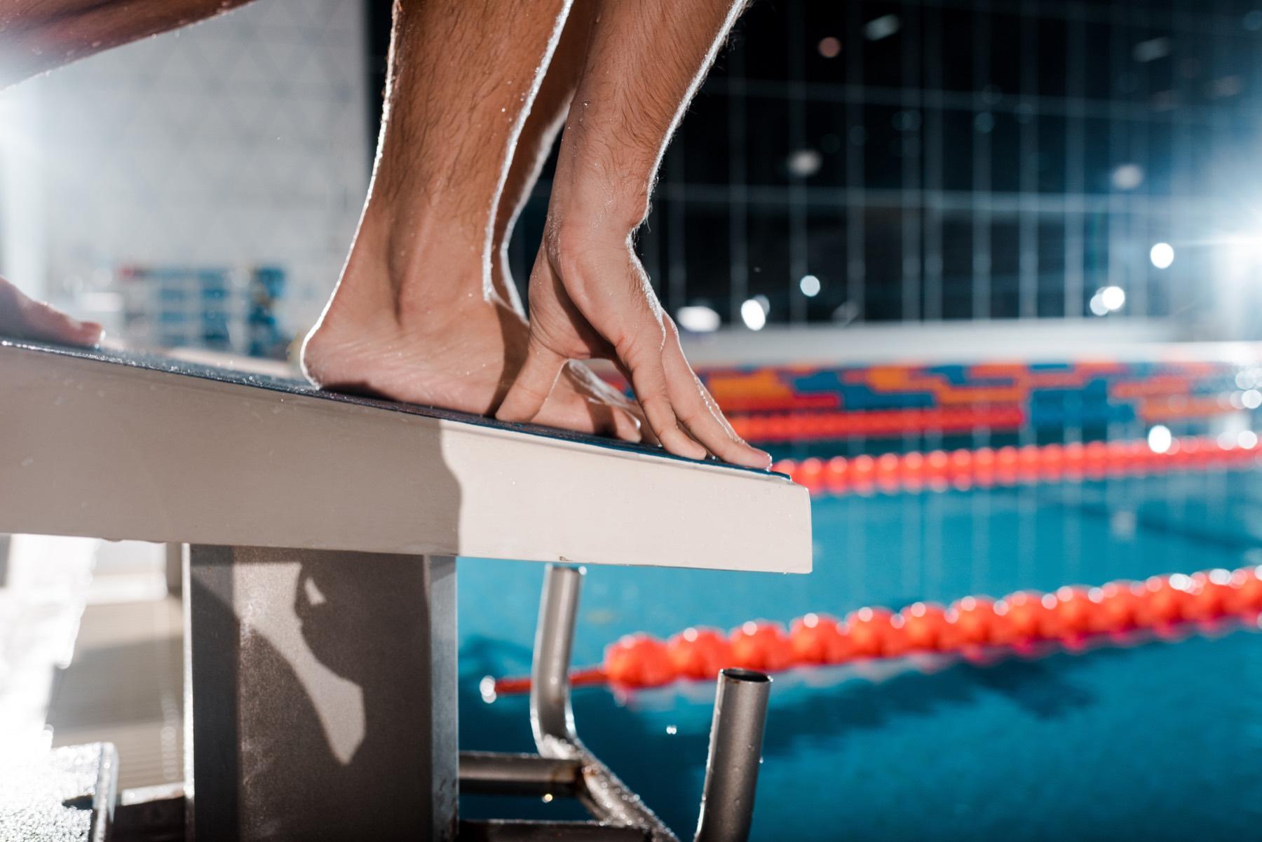 Swimmer practicing backstroke race skills