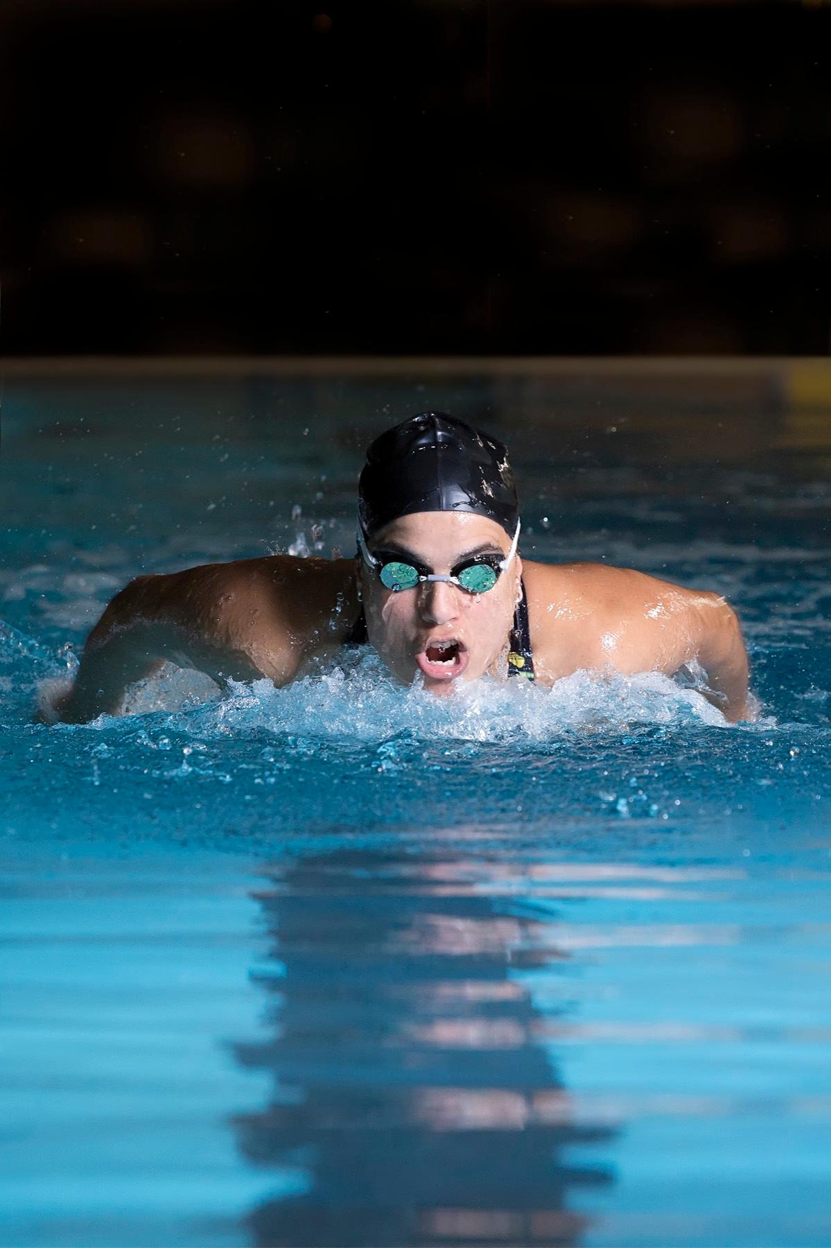 Butterfly swimmer training in pool