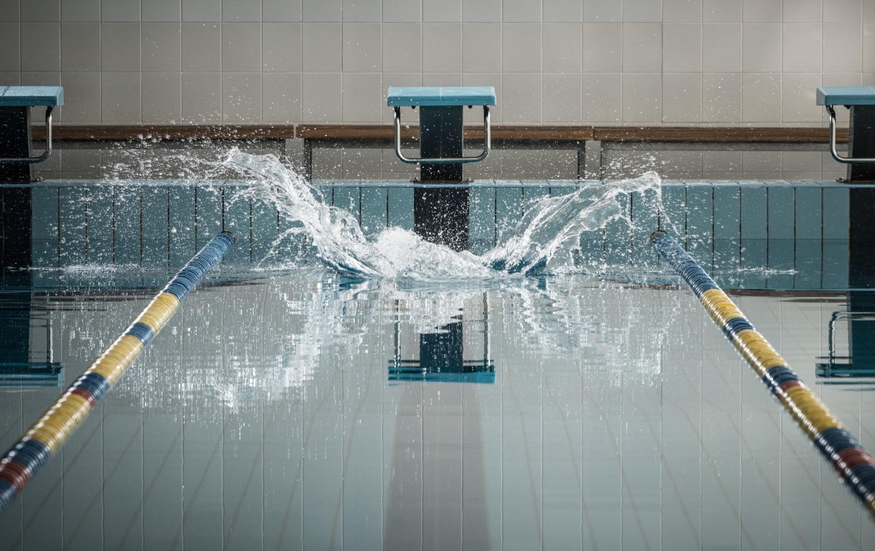 Competitive swimmer underwater in a lane pool