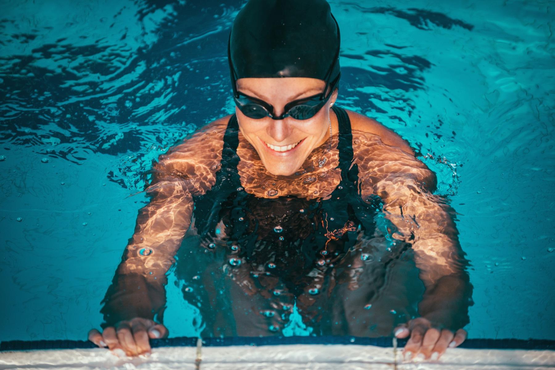 Triathlon swimmer training in lane pool